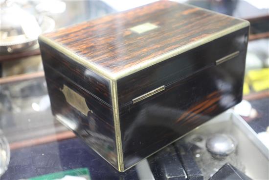 A Victorian brass mounted coromandel wood travelling toilet box containing ten silver mounted bottles/jars, 30.5cm.